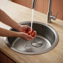 stainless-steel-kitchen-sink-washing-tomatoes